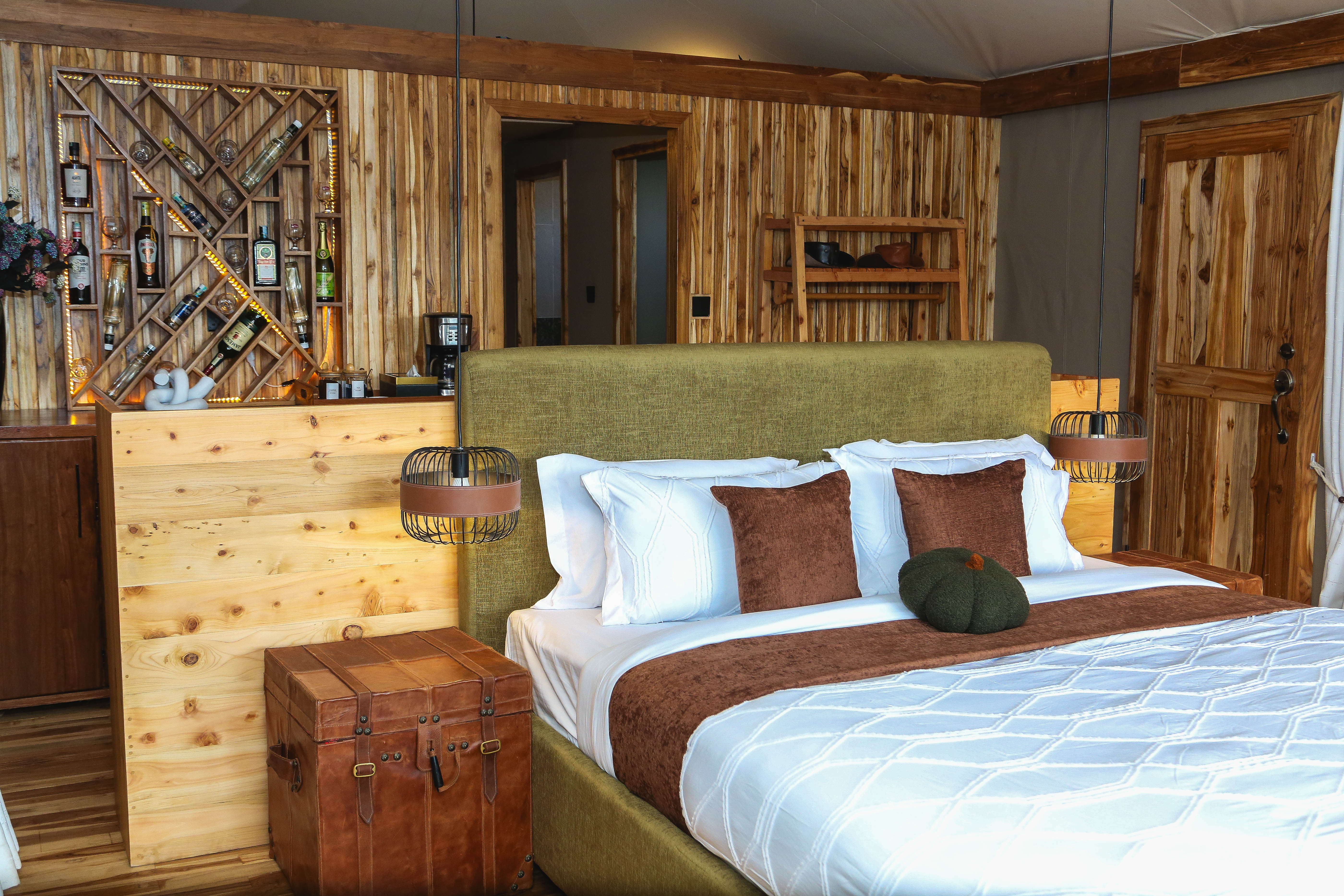Bedroom interior showcasing wine rack wall and sophisticated wooden details