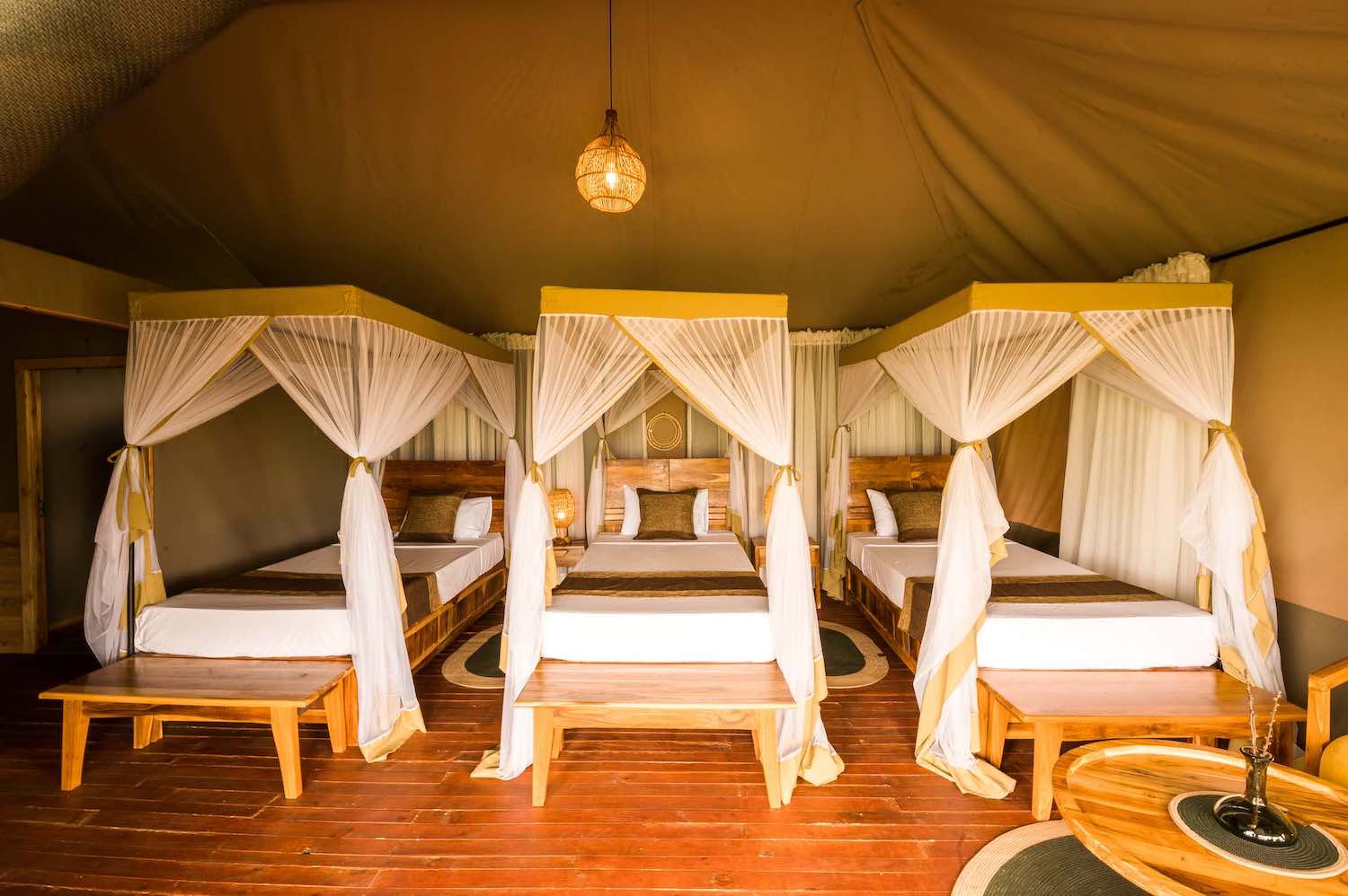 Family tent interior with multiple beds and traditional decor