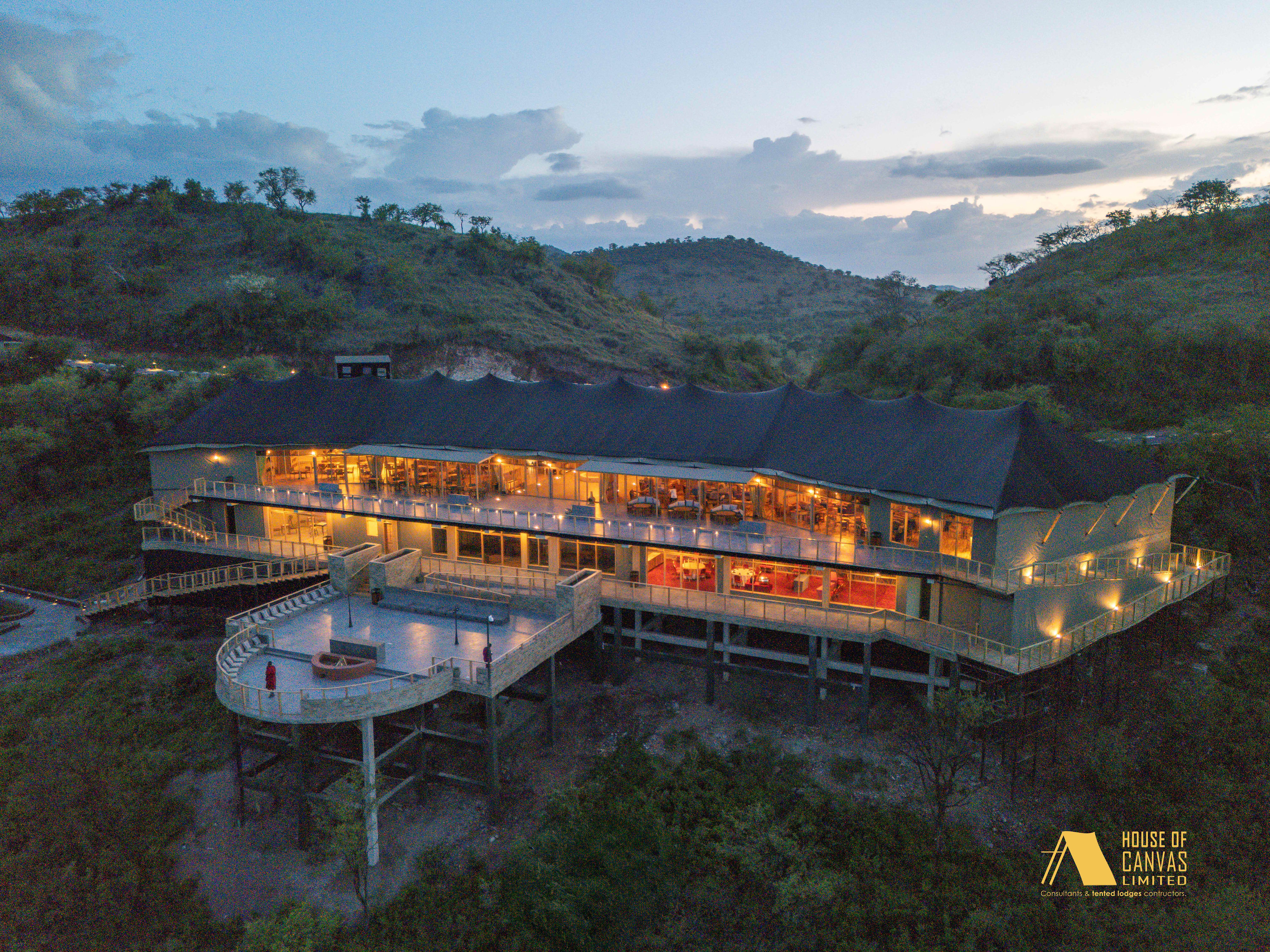 Aerial camp layout with natural landscape integration