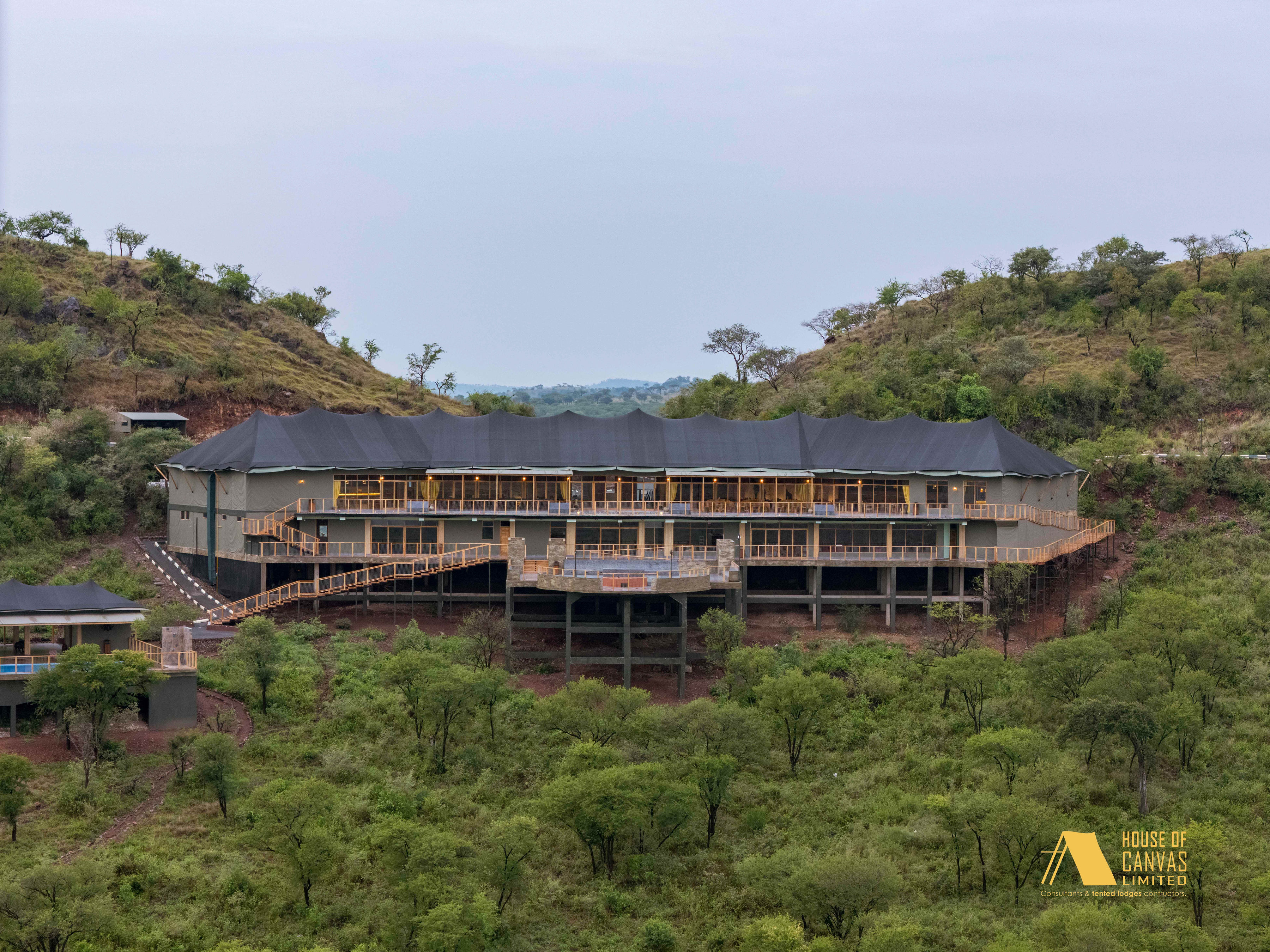 Golden hour aerial view of luxury tents