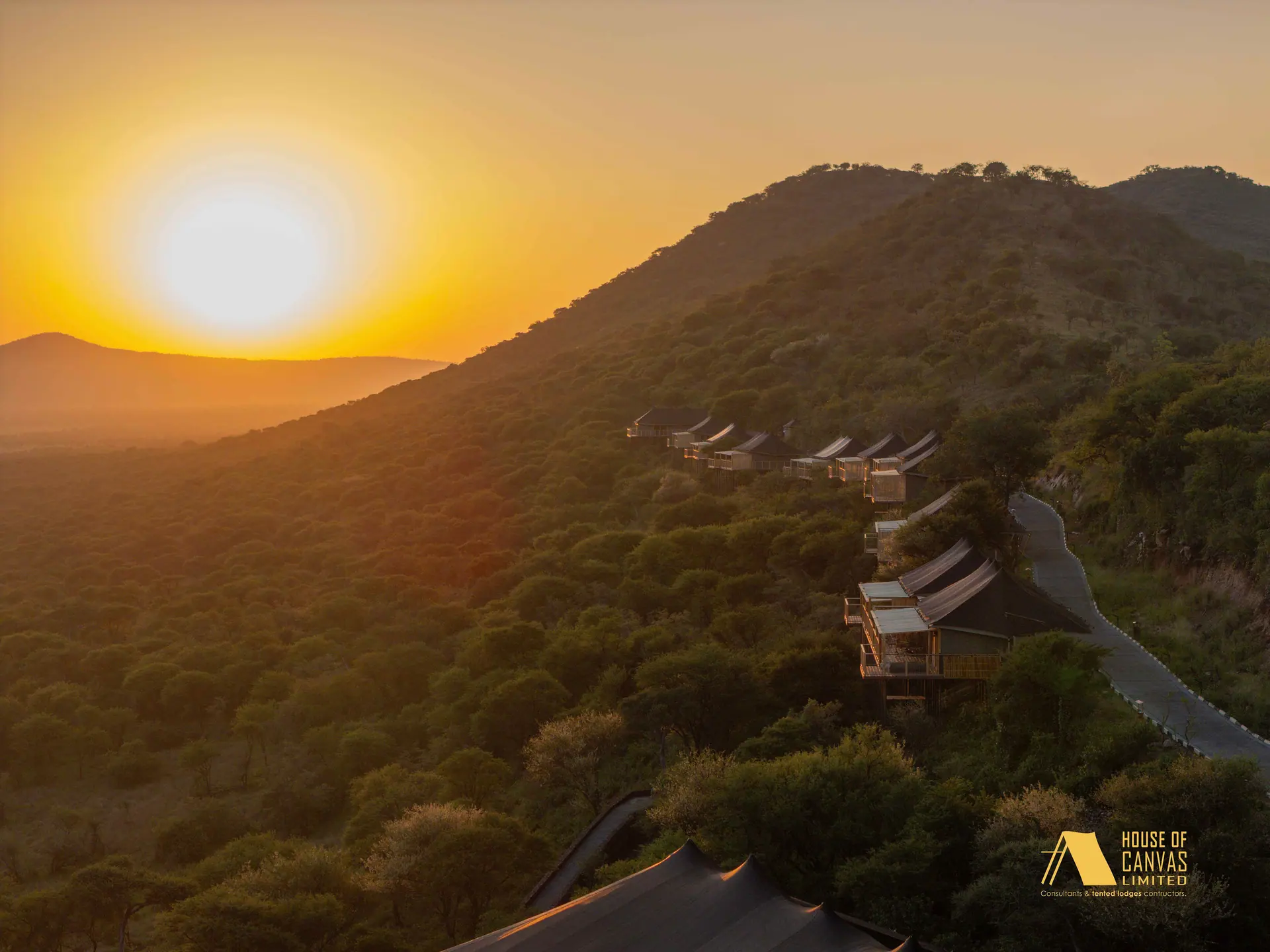 Aerial view of safari camp at twilight