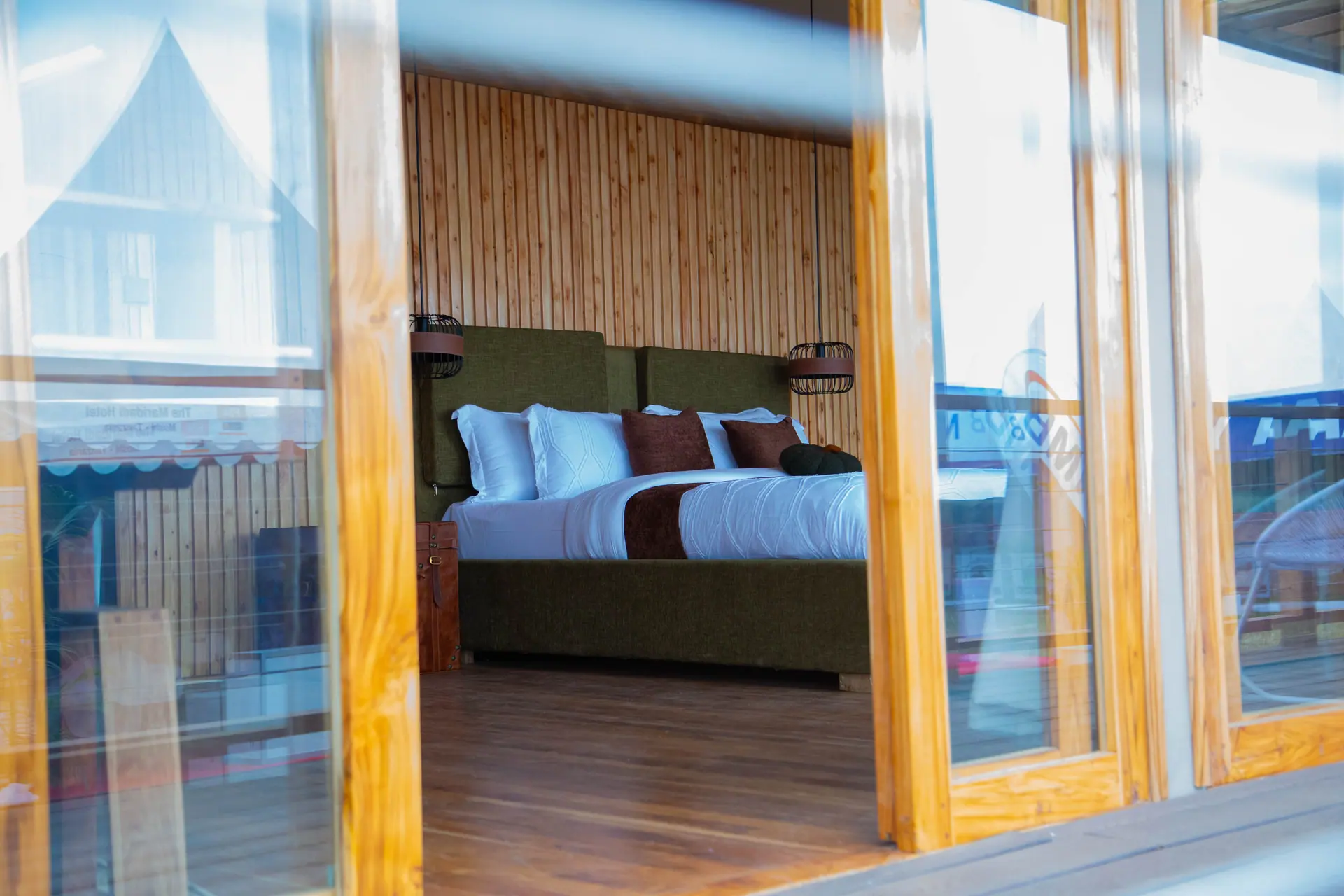 Tent bedroom seen through glass doors