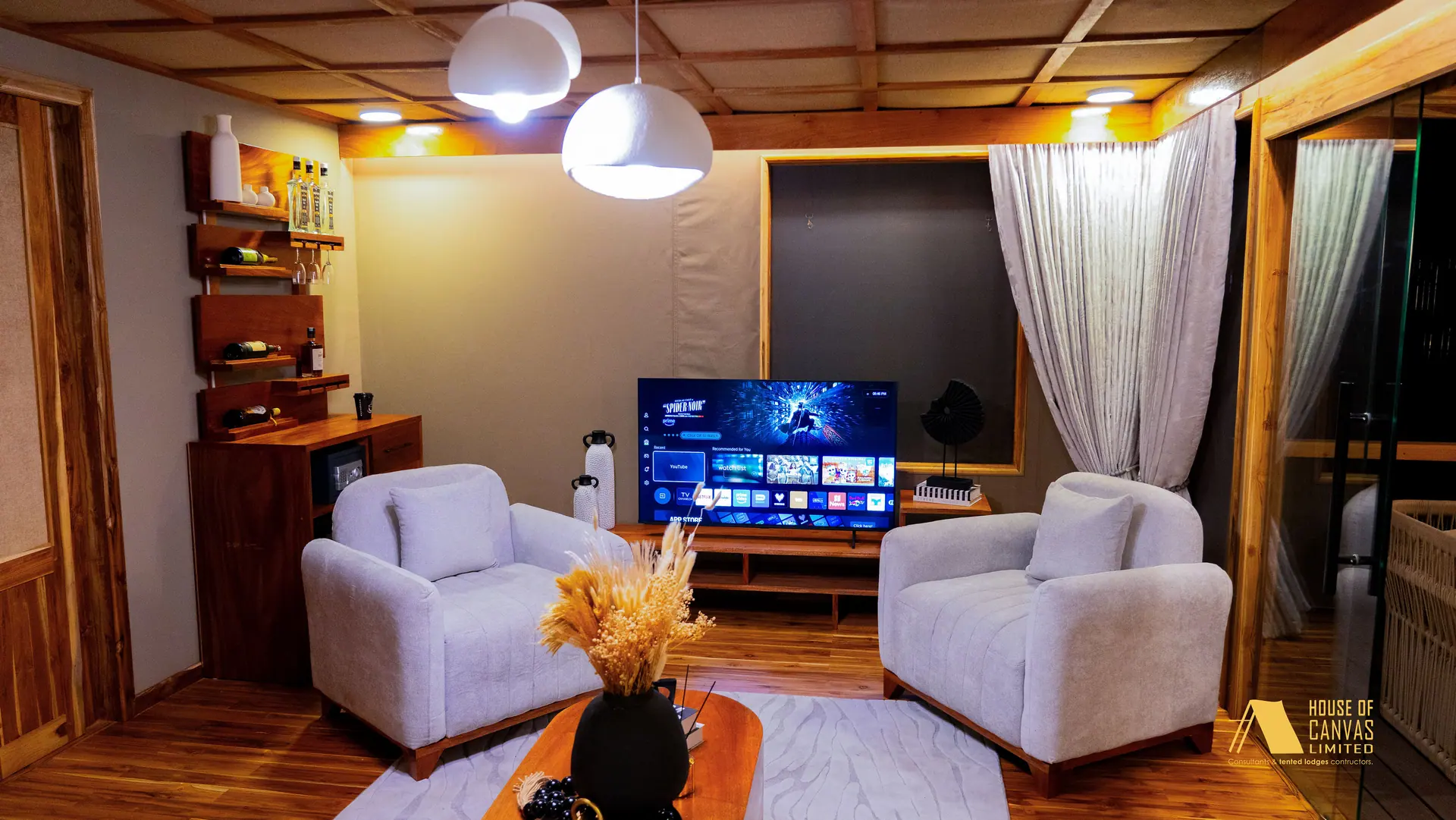Evening lounge with paired armchairs and pendant lighting at Kili Fair 2026