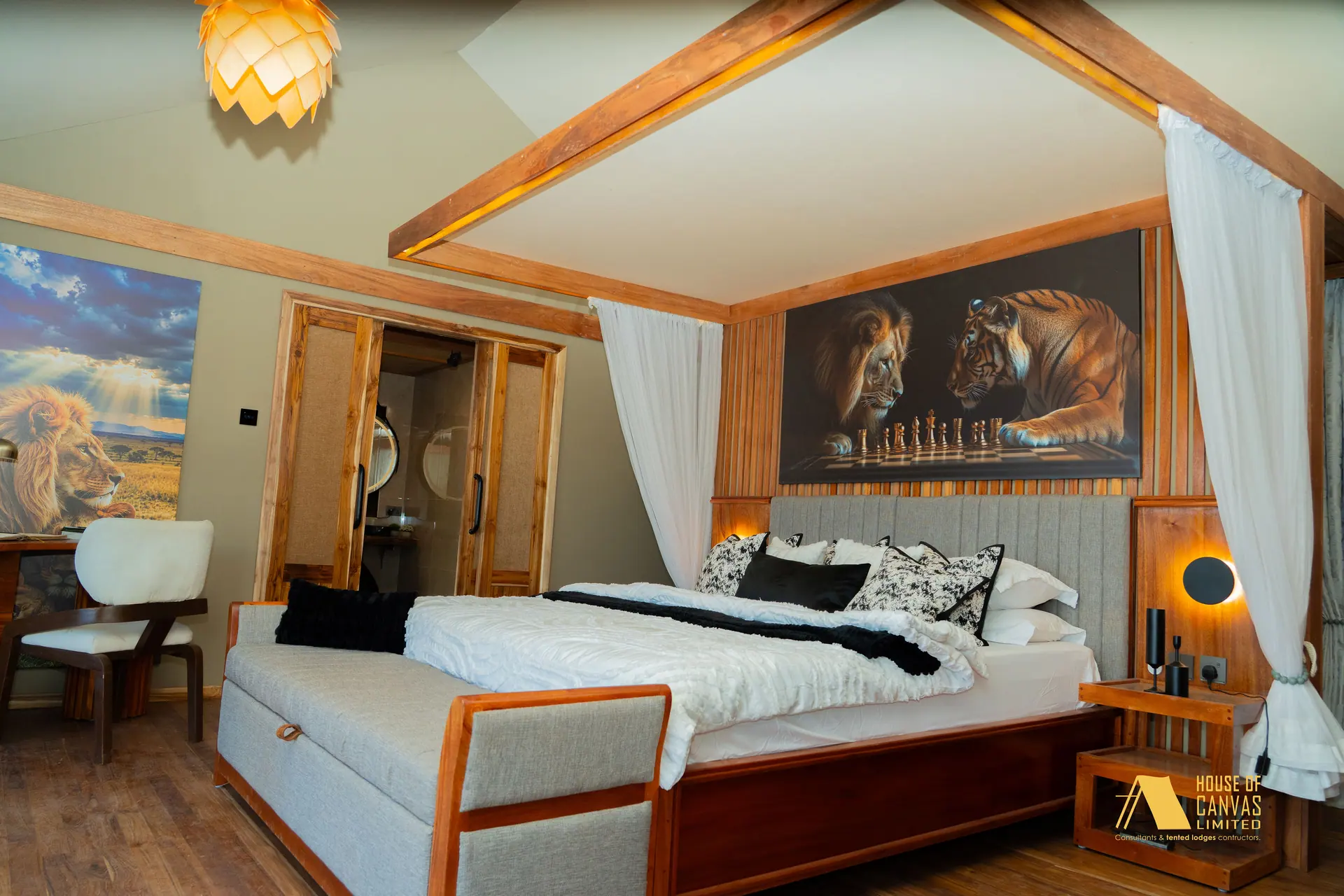 Kili Fair 2026 master suite with timber canopy bed and wildlife canvases